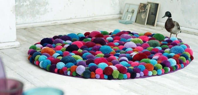 Make a colourful pom pom rug for the classroom