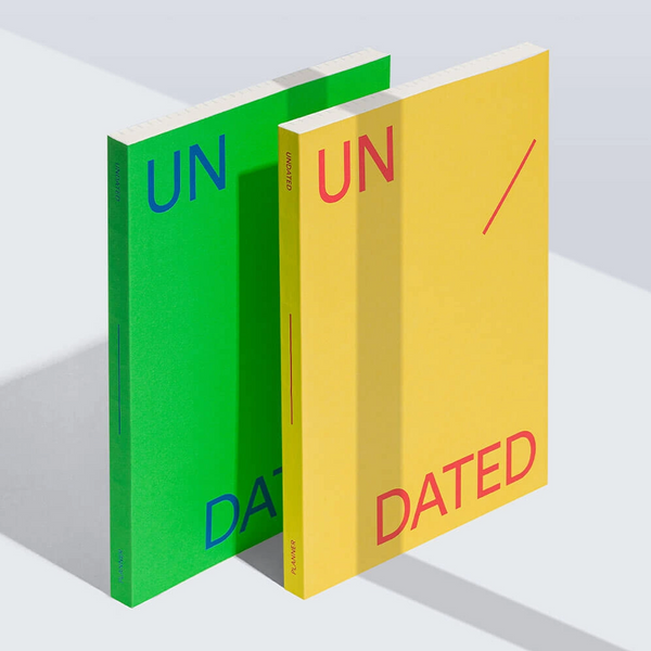 Two Undated planners by Mishmash – one in green and one in yellow.