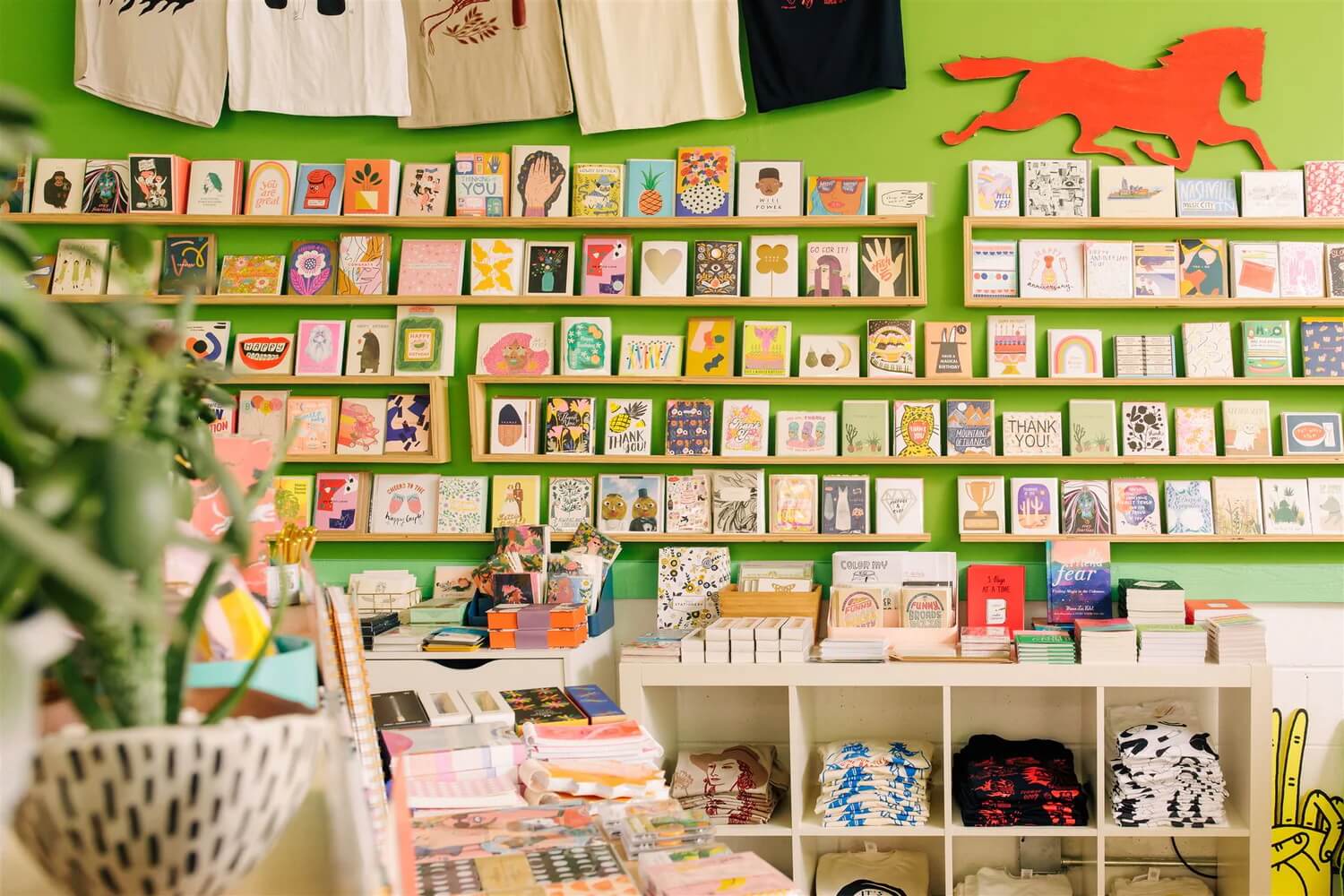 The wall of the Gift Horse store in Nashville, Tennessee featuring many paper goods including greetings cards, books and stationery.
